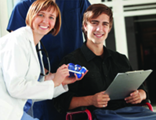 physician with young adult in wheelchair. page 15