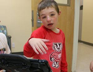 Boy using AAC device