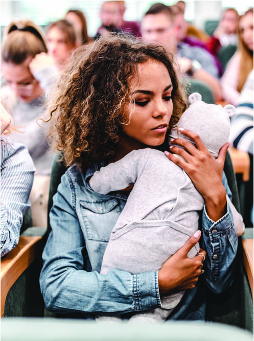 Mom holding infant